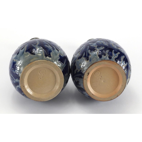 957 - Pair of 19th century Doulton Lambeth vases with unmarked silver rims, incised and hand painted with ... 