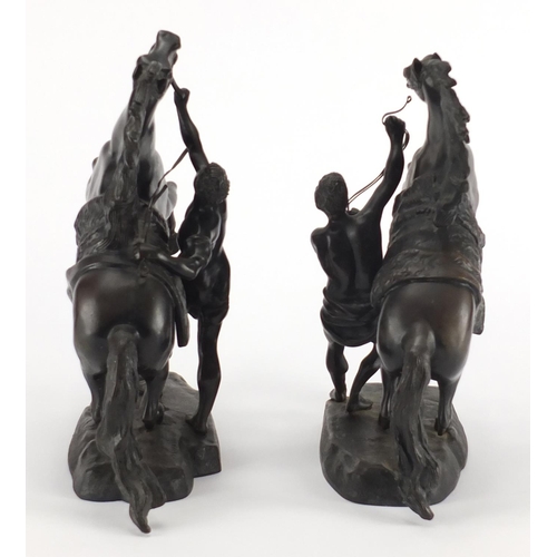 83 - After Guillaume Coustou The Elder - Pair of patinated bronze Marly horses with trainers, the largest... 