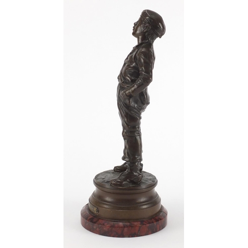 1009 - Halfdan Hertzberg - Siffleur, patinated bronze figure of a young, on circular red variegated marble ... 