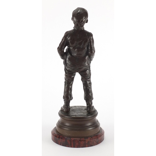 1009 - Halfdan Hertzberg - Siffleur, patinated bronze figure of a young, on circular red variegated marble ... 