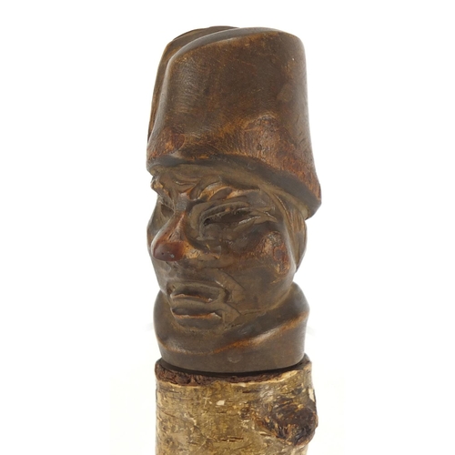 67 - Novelty treen container, the lid carved with a head, 22.5cm in length