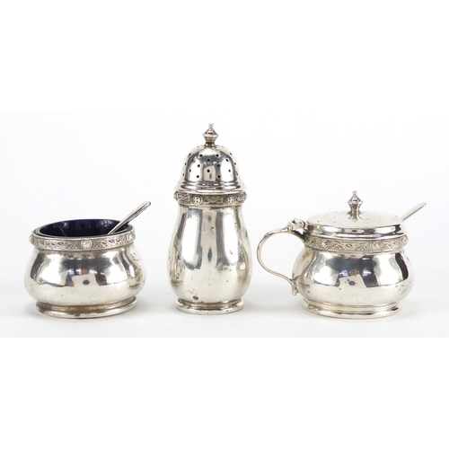 207 - Silver three piece cruet with blue glass liners by Adie Brothers Ltd, Birmingham 1936, housed in a S... 
