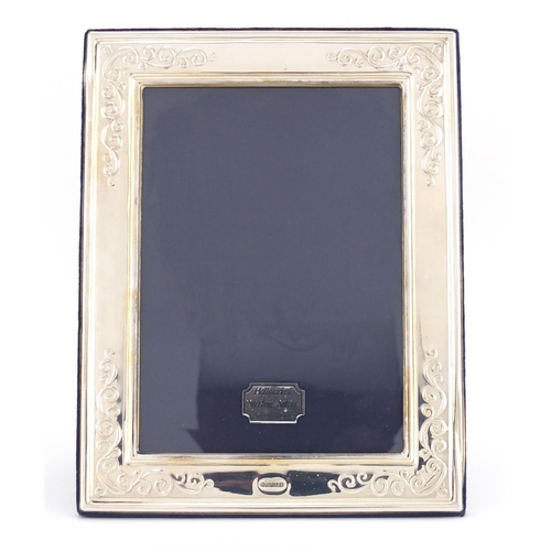 206 - Rectangular silver easel photo frame, with embossed decoration, by Carrs, 22.5cm x 18cm