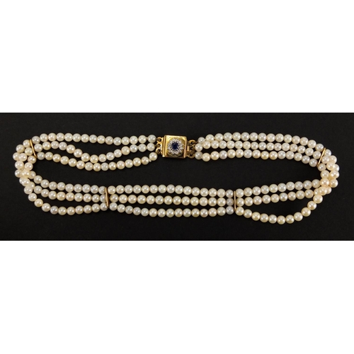 1051 - Three row pearl necklace with 18ct gold sapphire and diamond clasp, 32cm in length, approximate weig... 