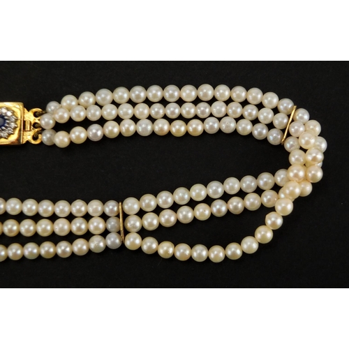 1051 - Three row pearl necklace with 18ct gold sapphire and diamond clasp, 32cm in length, approximate weig... 