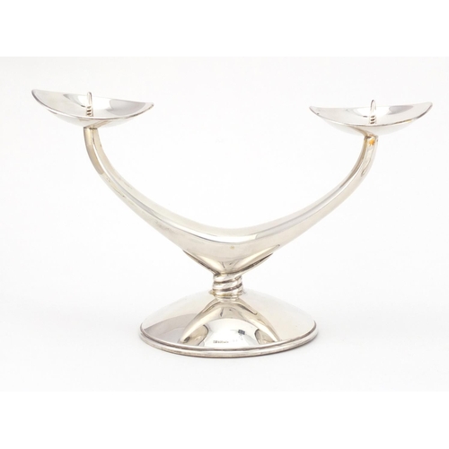 211 - Pair of Danish silver two branch candelabra, each stamped 835 WTB, 11cm high x 19cm wide, approximat... 
