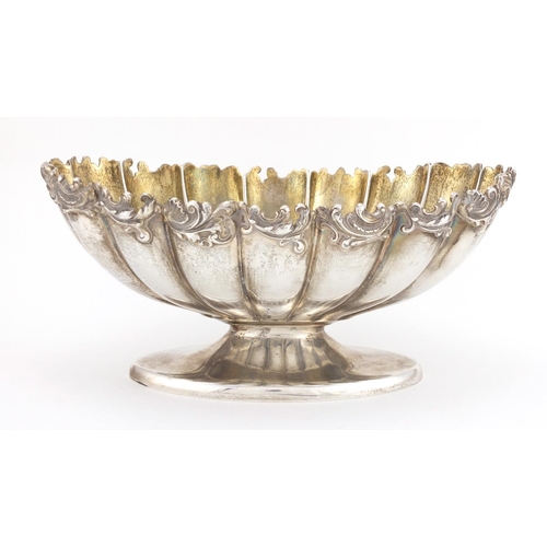 178 - American silver pedestal fruit bowl with cast floral border, stamped sterling to the base, 12cm high... 