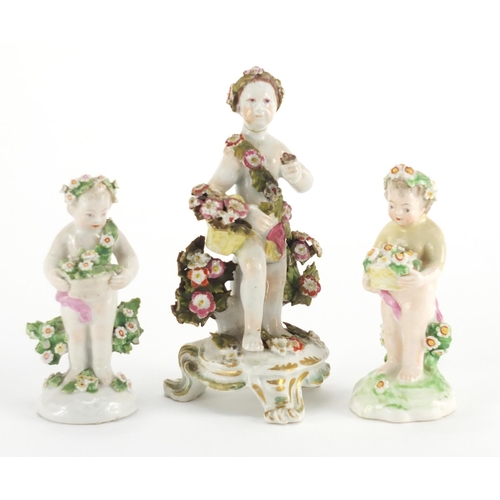 824 - Two 18th Century Bow porcelain cherubs with baskets of flowers and garlands together with a similar ... 