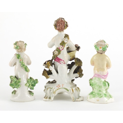 824 - Two 18th Century Bow porcelain cherubs with baskets of flowers and garlands together with a similar ... 