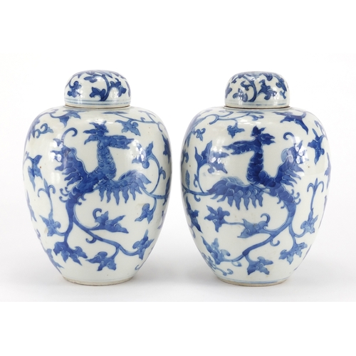 532 - Pair of Chinese blue and white porcelain jars and covers, each hand painted with two phoenixes among... 