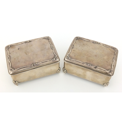 202 - Pair of rectangular silver jewel boxes, the hinged lids with embossed decoration, by W J Myatt & Co,... 