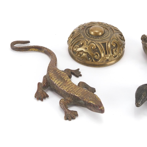 100 - Early 20th century Austrian Patinated bronze lizard, together with two brass paperweights and a bras... 