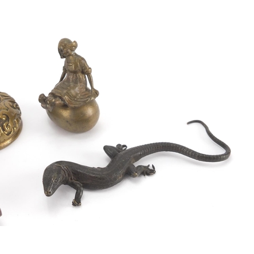 100 - Early 20th century Austrian Patinated bronze lizard, together with two brass paperweights and a bras... 