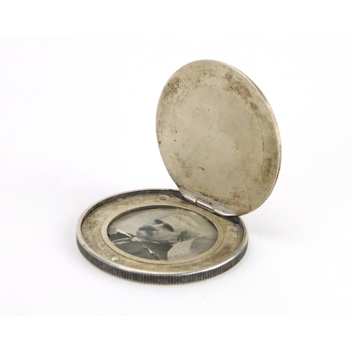 45 - Novelty 19th century trade dollar secret coin locket, 4cm in diameter, approximate weight 21.8g