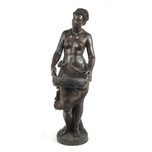 107 - 19th century floor standing terracotta figure of a semi nude African female holding a basket, in the... 