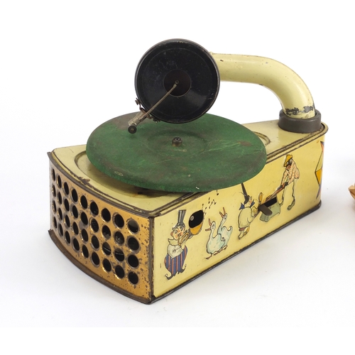 509 - Vintage German tin plate clockwork child's gramophone, with seven records, the gramophone printed ma... 