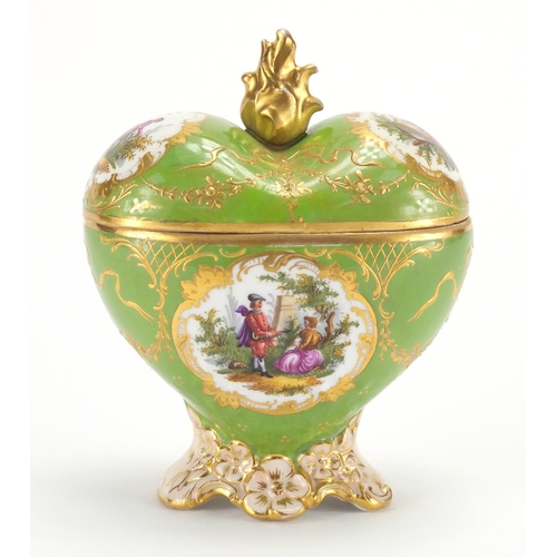 2190 - Dresden trinket box and cover of love heart form, hand painted with panels of lovers within gilt car... 