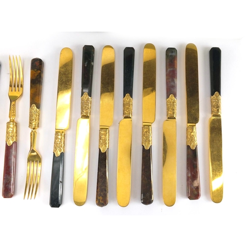 57 - Set of eight Scottish agate handled knives and forks, with gilt silver plated blades, the knives eac... 