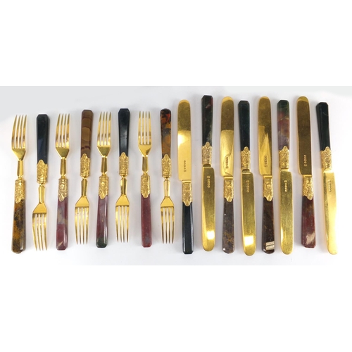 57 - Set of eight Scottish agate handled knives and forks, with gilt silver plated blades, the knives eac... 