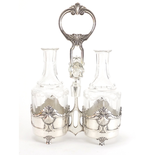 1025 - Art Nouveau Silver plated condiment set by WMF, housing a pair of cut glass bottles with stoppers, e... 