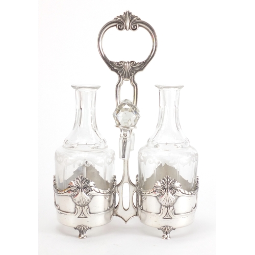 1025 - Art Nouveau Silver plated condiment set by WMF, housing a pair of cut glass bottles with stoppers, e... 