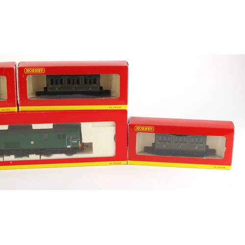 519A - Four Hornby OO gauge coaches and a diesel locomotive E6001, with boxes