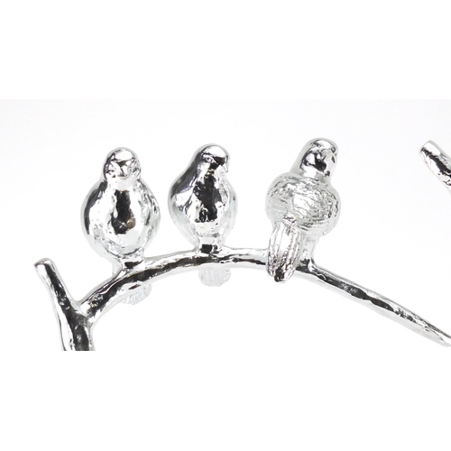 2281 - Two silvered models of three birds on a branch, the largest 51cm high