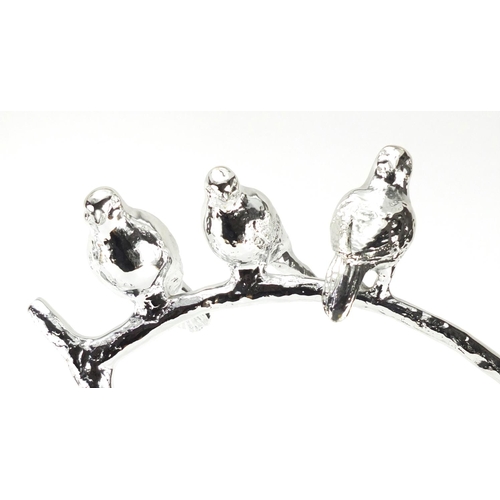 2281 - Two silvered models of three birds on a branch, the largest 51cm high