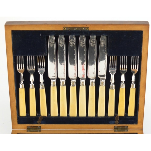 2272 - Mahogany six place canteen of  silver plated fish knives and forks, with ivory handles and silver co... 