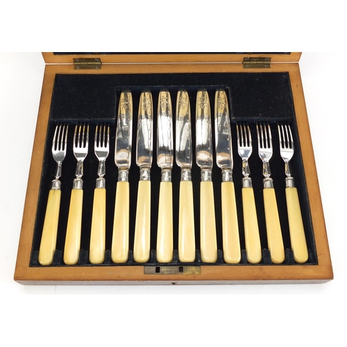 2272 - Mahogany six place canteen of  silver plated fish knives and forks, with ivory handles and silver co... 