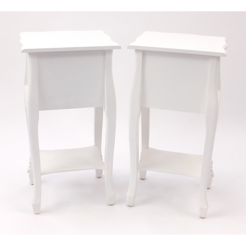 2100 - Pair of white painted night stands, each fitted with two drawers and with swag decoration, 75cm H x ... 