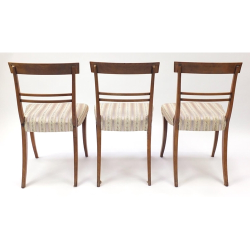 2101 - Set of six Regency mahogany dining chairs, with carved top rails and striped upholstered stuff over ... 