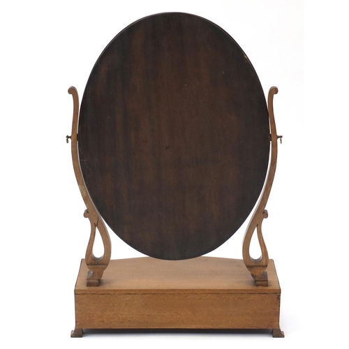 2146 - Oval mahogany toilet mirror, the serpentine fronted base with three drawers, 72cm high