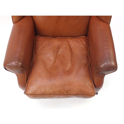 2024 - Mahogany framed brown leather wingback armchair, 104cm high