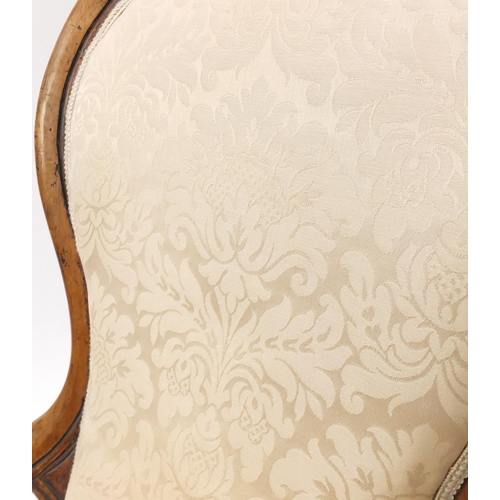 2097 - Victorian carved walnut gentleman's chair, with beige floral upholstery, 101.5cm high