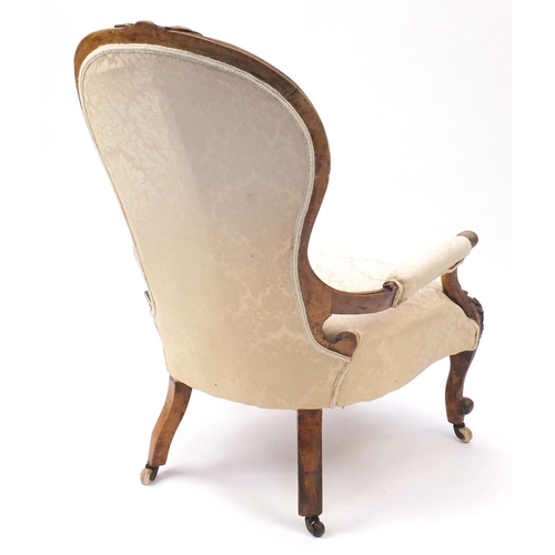 2097 - Victorian carved walnut gentleman's chair, with beige floral upholstery, 101.5cm high