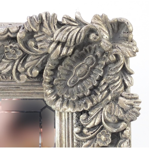 2096 - Large rectangular bevelled edge mirror, the silvered frame with applied shell and floral motifs, 166... 