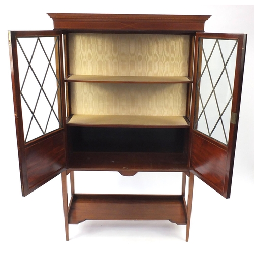 2135 - Edwardian inlaid mahogany china cabinet, fitted with a pair of lozenge glazed doors enclosing two sh... 