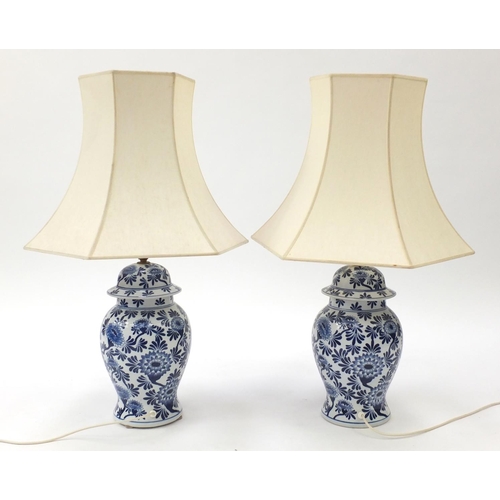 2269 - Pair of blue and white floral painted porcelain table lamps with shades, 80cm high