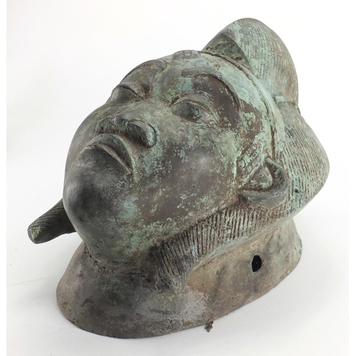 2327 - Patinated brass face mask of an Afrcian female's head, 36cm high