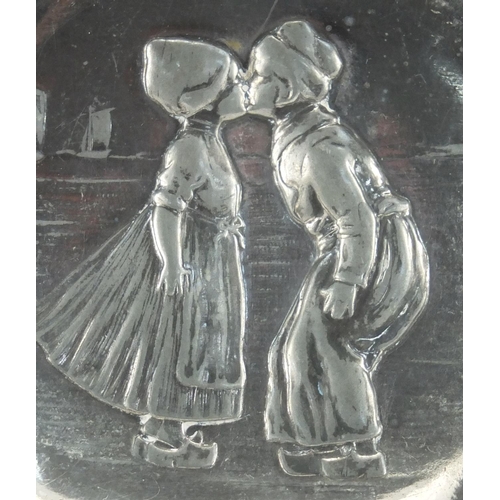 2214 - Art Nouveau pewter four footed dish by WMF, embossed with a Dutch boy and girl, impressed marks and ... 