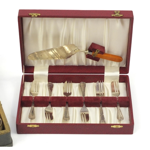 2227 - Three sets of silver plated cutlery including a six place canteen with ivorine handles and a pair of... 