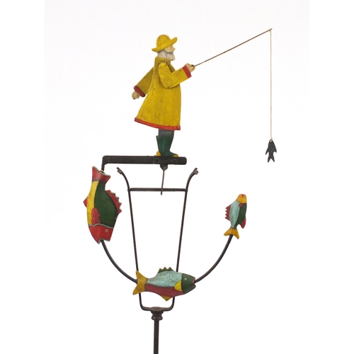 2128 - Novelty hand painted wrought iron fisherman design wind operated garden ornament, with tripod base, ... 