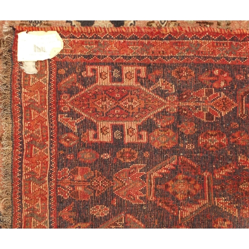 2045 - Rectangular Persian Qashqai rug having an all over stylised floral design, 270cm x 175cm