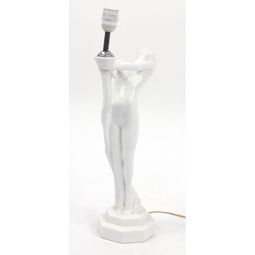 2346 - White glazed porcelain lamp and shade, in the form of a nude Art Deco female with out stretched arms... 