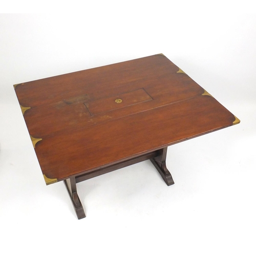 2077 - Mahogany campaign style drop leaf table, with brass fittings, 71cm H x 107cm W x 31cm D (extending t... 