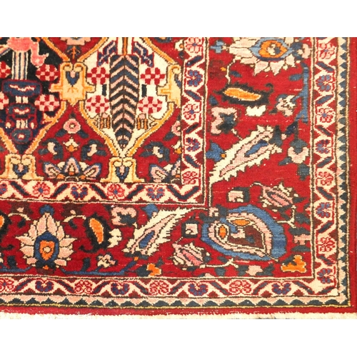 2010 - Rectangular Persian Baktiari rug, the central field having all over diamond medallions enclosing flo... 