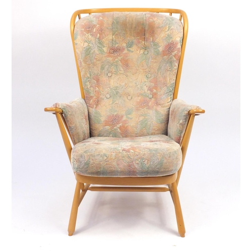 2141 - Ercol light elm Evergreen stick back armchair, with floral button back upholstery, 102cm high