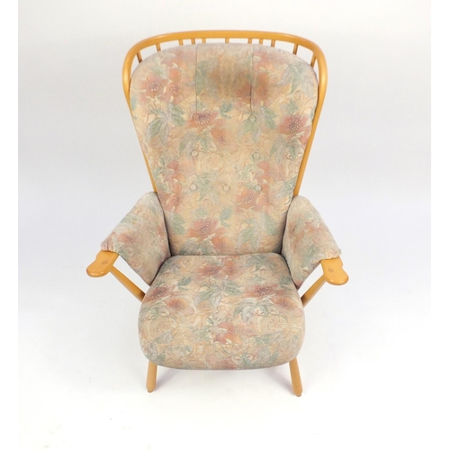 2141 - Ercol light elm Evergreen stick back armchair, with floral button back upholstery, 102cm high