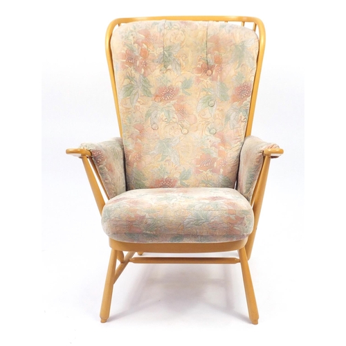 2140 - Ercol light elm Evergreen stick back armchair, with floral button back upholstery, 102cm high